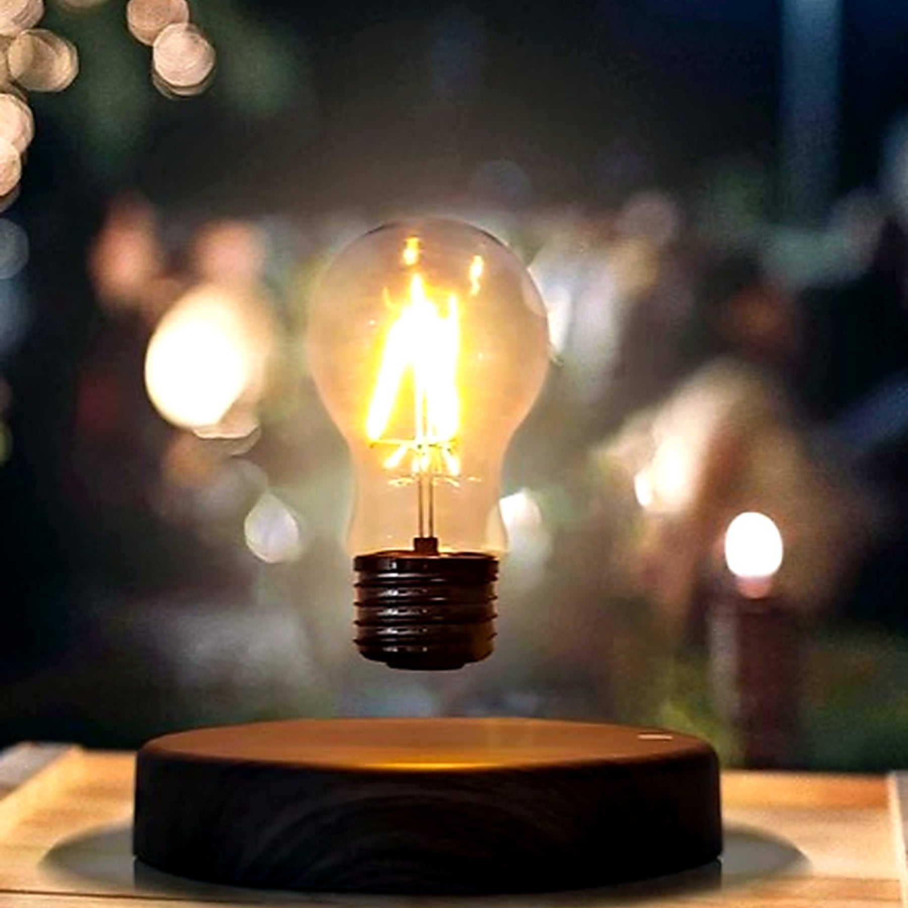 Floating bulb lamp glowing on a table